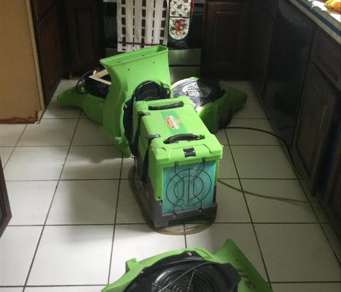 kitchen with multiple pieces of drying equipment in it 