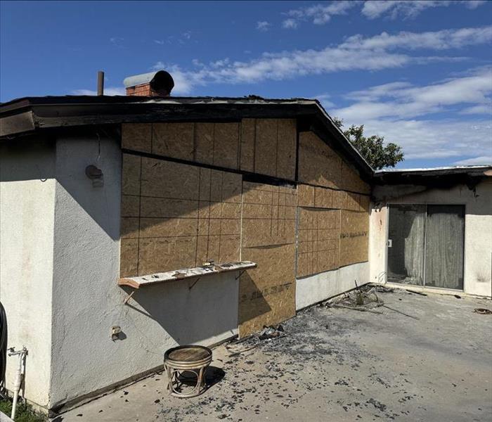 Exterior board-up due to a fire.